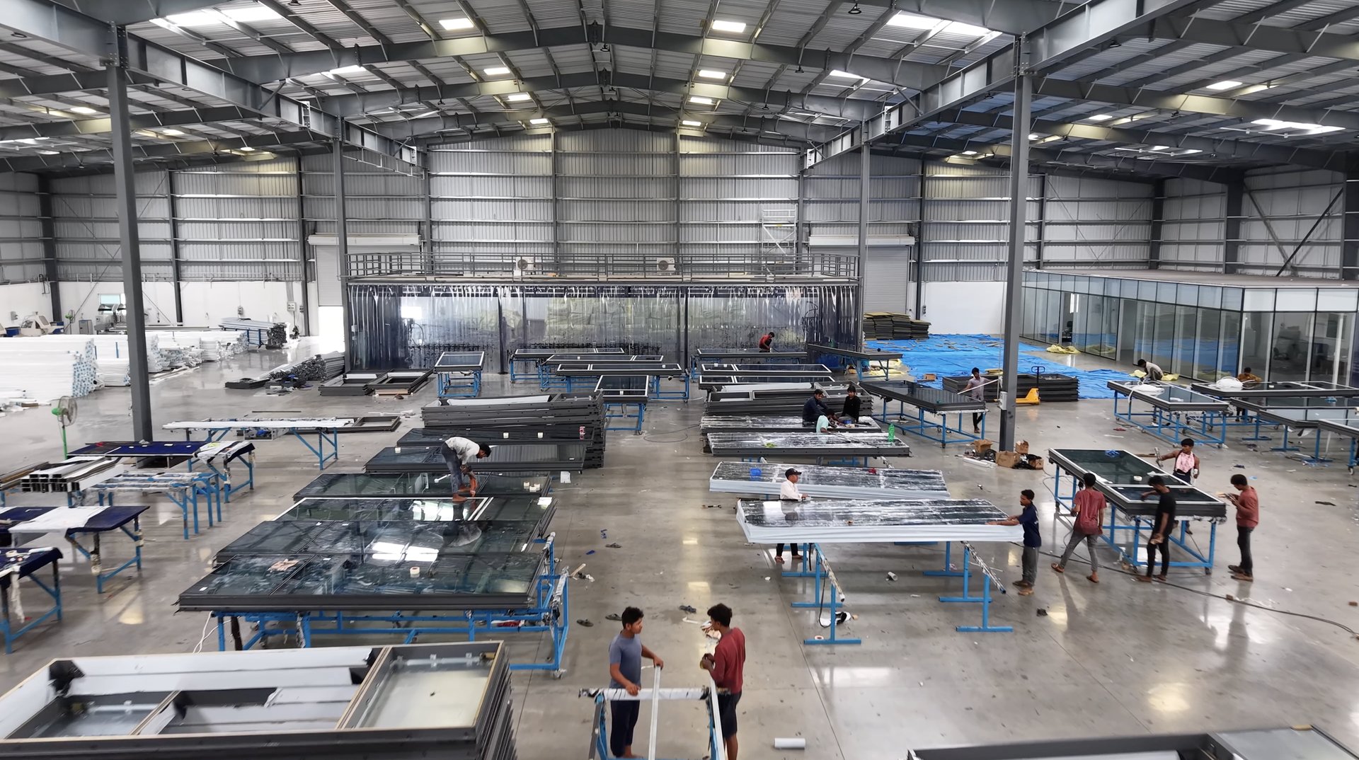 Assembly tables on the production floor at Chandanvelly